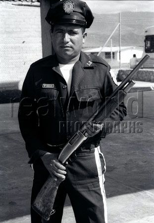 A police officer from the state of Puebla shows off a piece of Mexican justice. Puebla, Mexico.